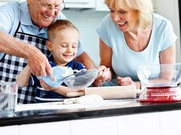 Senior couple and small kid preparing food Senior couple and small kid preparing food in the kitchen